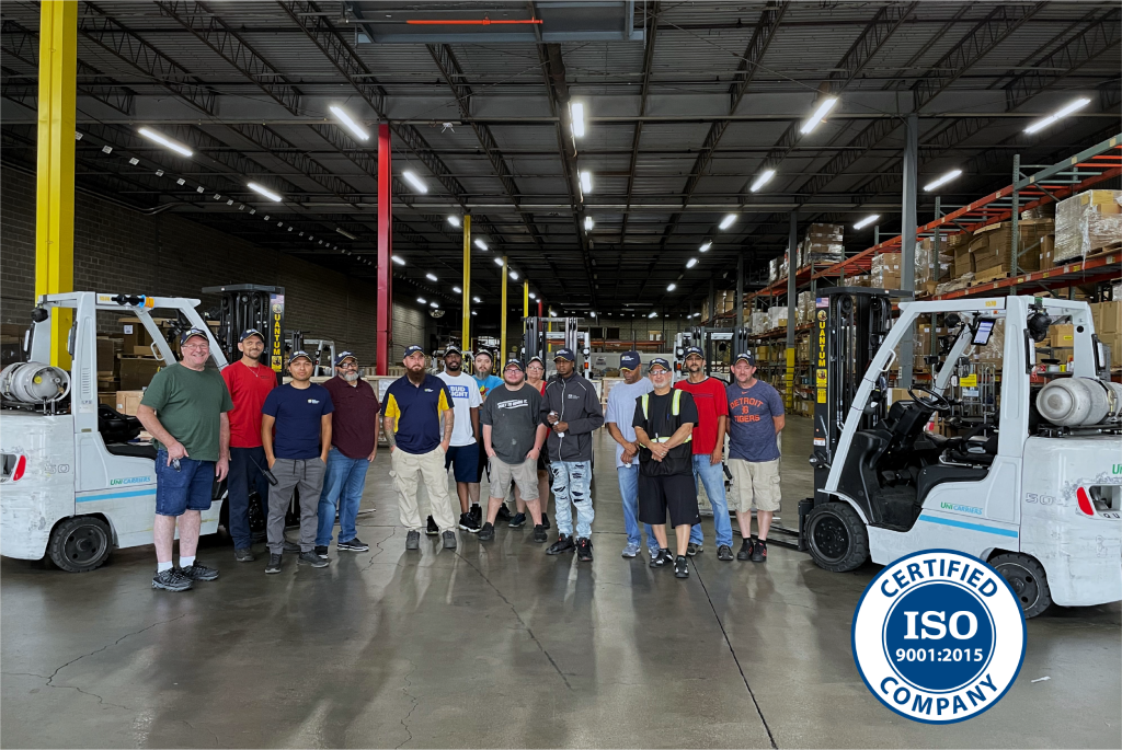 Warehouse operations team with ISO logo.